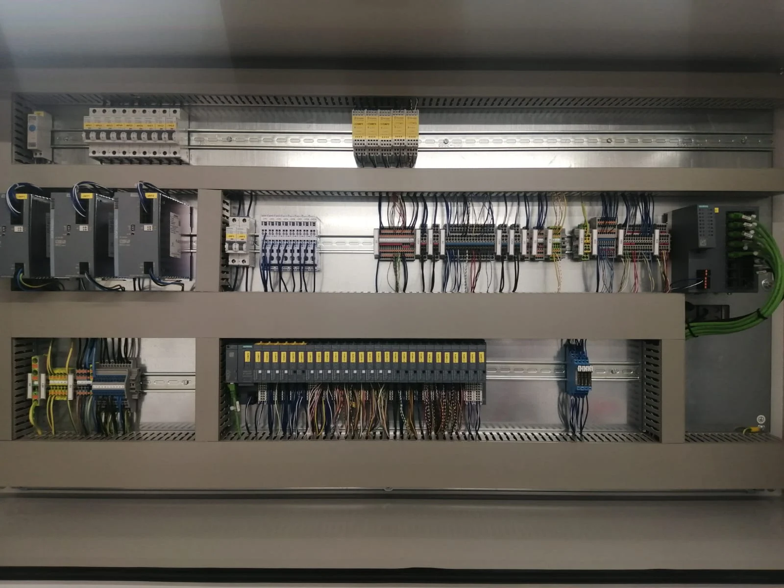 Wired control cabinet with control modules and terminal blocks
